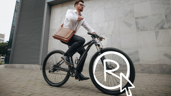 Man op fiets en icoon van een r-teken