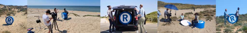 Film crew with R-sign on the beach