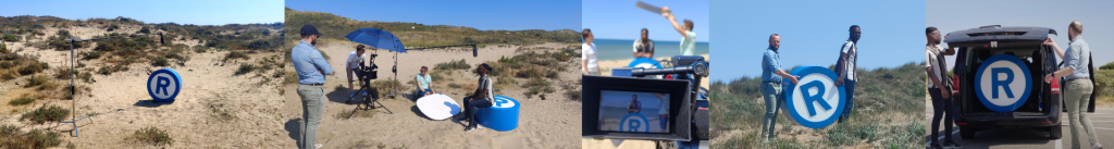 Het R-teken en de filmcrew op het strand bij het maken van de video